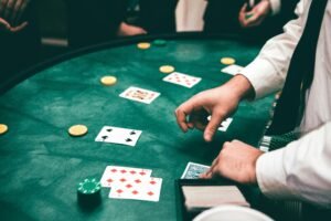 Casino scene with dealer and players, featuring cards and chips, creating a suspenseful atmosphere.
